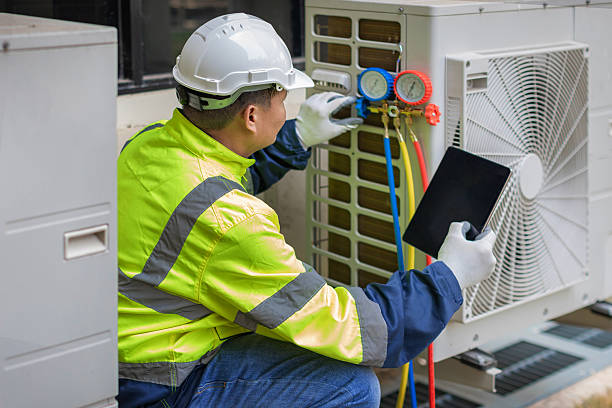 Professional Heat Pump Repair technician working in Rogersville, AL